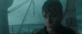 Movie still from “The Finest Hours” (2016), directed by Craig Gillespie – A person with a wet shirt on; Close Up shot, Low angle