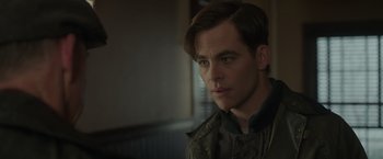 Movie still from “The Finest Hours” (2016), directed by Craig Gillespie – A person wearing a jacket; Close Up shot, Over the shoulder angle