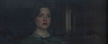 Movie still from “The Finest Hours” (2016), directed by Craig Gillespie – A woman with red lipstick looking out of a window; Close Up shot, Over the shoulder angle