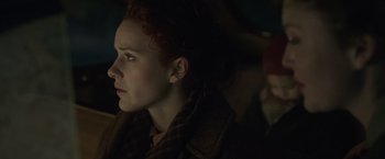 Movie still from “The Finest Hours” (2016), directed by Craig Gillespie – A young woman is sitting in a dark room; Close Up shot, Low angle