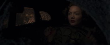 Movie still from “The Finest Hours” (2016), directed by Craig Gillespie – A woman sitting in a car in the dark; Close Up shot, Over the shoulder angle