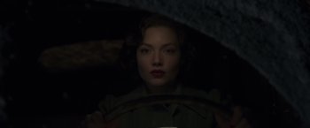 Movie still from “The Finest Hours” (2016), directed by Craig Gillespie – A woman sitting behind a steering wheel in a dark room; Close Up shot, Low angle