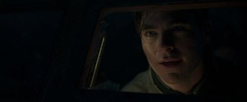 Movie still from “The Finest Hours” (2016), directed by Craig Gillespie – A man looking into a broken mirror in the dark; Close Up shot, Low angle