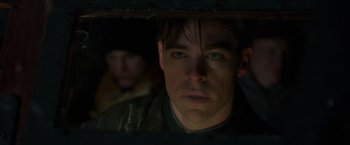 Movie still from “The Finest Hours” (2016), directed by Craig Gillespie – A person looking through a window; Close Up shot, Low angle