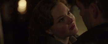 Movie still from “The Finest Hours” (2016), directed by Craig Gillespie – A woman's face in the dark; Close Up shot, Over the shoulder angle