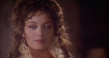 Movie still from “The Great Train Robbery” (1978), directed by Michael Crichton – A person with long hair; Close Up shot, Over the shoulder angle
