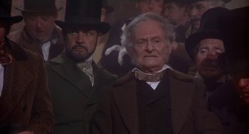 Movie still from “The Great Train Robbery” (1978), directed by Michael Crichton – Two men dressed up in old fashion clothes; Medium shot, Low angle