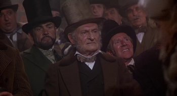 Movie still from “The Great Train Robbery” (1978), directed by Michael Crichton – A group of men in top hats and coats; Medium shot, Low angle