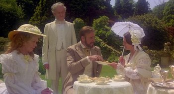 Movie still from “The Great Train Robbery” (1978), directed by Michael Crichton – A man and a woman sitting in front of a table; Medium shot, Over the shoulder angle