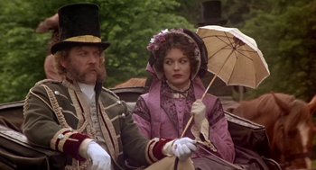 Movie still from “The Great Train Robbery” (1978), directed by Michael Crichton – A man and a woman dressed in victorian clothing; Medium shot, High angle