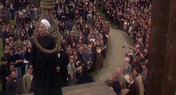 Movie still from “The Great Train Robbery” (1978), directed by Michael Crichton – A crowd of people sitting and standing in a crowd; Extreme Wide shot, High angle