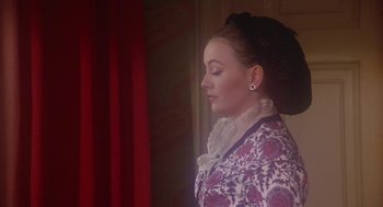 Movie still from “The Great Train Robbery” (1978), directed by Michael Crichton – A woman wearing a hat and a long dress; Close Up shot, Over the shoulder angle