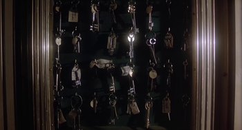 Movie still from “The Great Train Robbery” (1978), directed by Michael Crichton – A bunch of keys hanging on a wall in the dark; Extreme Close Up shot, High angle