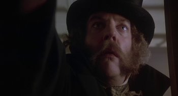 Movie still from “The Great Train Robbery” (1978), directed by Michael Crichton – A person wearing a hat; Close Up shot, Low angle