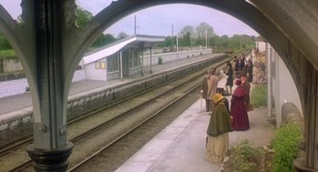 Movie still from “The Great Train Robbery” (1978), directed by Michael Crichton – A group of people standing next to a train station platform; Extreme Wide shot, High angle