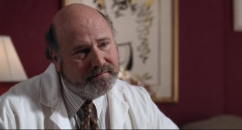 Movie still from “The First Wives Club” (1996), directed by Hugh Wilson – An older man with a beard and a tie; Close Up shot, Low angle