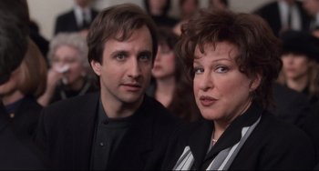 Movie still from “The First Wives Club” (1996), directed by Hugh Wilson – A man and a woman standing next to each other; Close Up shot, Over the shoulder angle