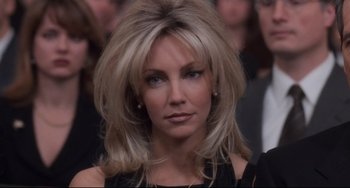 Movie still from “The First Wives Club” (1996), directed by Hugh Wilson – A person with long blonde hair; Close Up shot, Over the shoulder angle