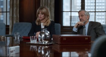 Movie still from “The First Wives Club” (1996), directed by Hugh Wilson – A woman sitting at a table in front of a man; Medium shot, Over the shoulder angle