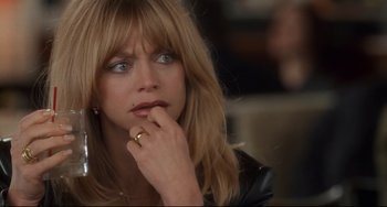 Movie still from “The First Wives Club” (1996), directed by Hugh Wilson – A person wearing a ring; Close Up shot, Over the shoulder angle