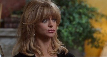 Movie still from “The First Wives Club” (1996), directed by Hugh Wilson – A person with long blonde hair; Close Up shot, Over the shoulder angle