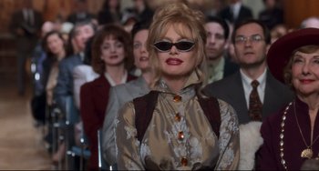 Movie still from “The First Wives Club” (1996), directed by Hugh Wilson – A group of people standing in a room; Medium shot, Low angle