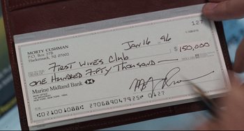 Movie still from “The First Wives Club” (1996), directed by Hugh Wilson – A check signed by a person; Extreme Close Up shot, Overhead angle