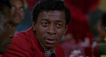 Movie still from “The Five Heartbeats” (1991), directed by Robert Townsend – A person wearing a red jacket; Close Up shot, Low angle