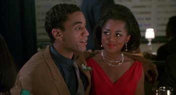 Movie still from “The Five Heartbeats” (1991), directed by Robert Townsend – A man and a woman posing for a picture; Close Up shot, Over the shoulder angle