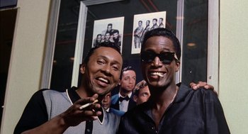 Movie still from “The Five Heartbeats” (1991), directed by Robert Townsend – A couple of men standing next to each other in a room; Close Up shot, Low angle