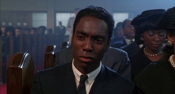 Movie still from “The Five Heartbeats” (1991), directed by Robert Townsend – A man in a suit and tie; Close Up shot, Low angle