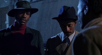Movie still from “The Five Heartbeats” (1991), directed by Robert Townsend – A couple of men standing next to each other wearing hats; Close Up shot, Low angle