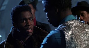 Movie still from “The Five Heartbeats” (1991), directed by Robert Townsend – Two men talking to each other in a dark room; Close Up shot, Over the shoulder angle