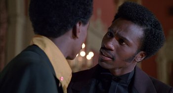 Movie still from “The Five Heartbeats” (1991), directed by Robert Townsend – Two men talking to each other in front of lights; Close Up shot, Over the shoulder angle