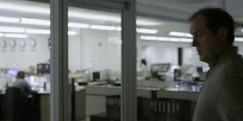 A view of an office from behind a glass door