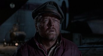 Movie still from “The Flight of the Phoenix” (1965), directed by Robert Aldrich – A person wearing a hat; Close Up shot, Low angle