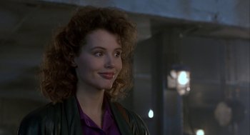 Movie still from “The Fly” (1986), directed by David Cronenberg – A person with curly hair; Close Up shot, Over the shoulder angle