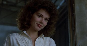 Movie still from “The Fly” (1986), directed by David Cronenberg – A person wearing a white shirt; Close Up shot, Low angle