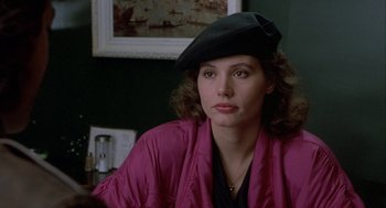 Movie still from “The Fly” (1986), directed by David Cronenberg – A person wearing a hat; Close Up shot, Over the shoulder angle