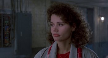 Movie still from “The Fly” (1986), directed by David Cronenberg – A person wearing a jacket; Close Up shot, Over the shoulder angle
