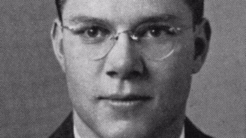 Movie still from “The Fog of War” (2003), directed by Errol Morris – An old black and white photo of a man wearing glasses; Close Up shot, Overhead angle