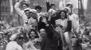 Movie still from “The Fog of War” (2003), directed by Errol Morris – A group of people that are standing in a crowd; Medium shot, High angle