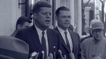 Movie still from “The Fog of War” (2003), directed by Errol Morris – A black and white photo of john f; Close Up shot, Low angle