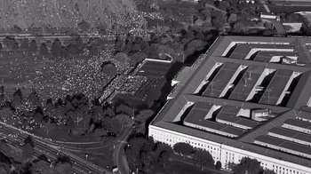 Movie still from “The Fog of War” (2003), directed by Errol Morris – An aerial view of the pentagon with a large crowd of people; Extreme Wide shot, Overhead angle