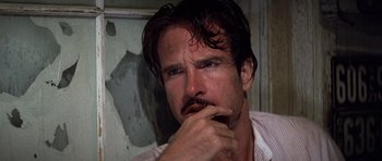 Movie still from “The Fortune” (1975), directed by Mike Nichols – A person with his hand under his chin; Close Up shot, Low angle