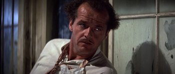 Movie still from “The Fortune” (1975), directed by Mike Nichols – A person wearing a shirt and tie; Close Up shot, Low angle