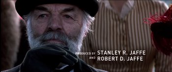 Movie still from “The Four Feathers” (2002), directed by Shekhar Kapur – An old man with a beard wearing a hat; Close Up shot, Over the shoulder angle