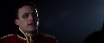 Movie still from “The Four Feathers” (2002), directed by Shekhar Kapur – A man in a red and gold military uniform; Close Up shot, Low angle