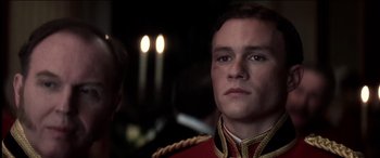 Movie still from “The Four Feathers” (2002), directed by Shekhar Kapur – A person wearing a military uniform; Close Up shot, Over the shoulder angle
