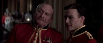 Movie still from “The Four Feathers” (2002), directed by Shekhar Kapur – Two men in military uniforms posing for a picture; Close Up shot, Low angle